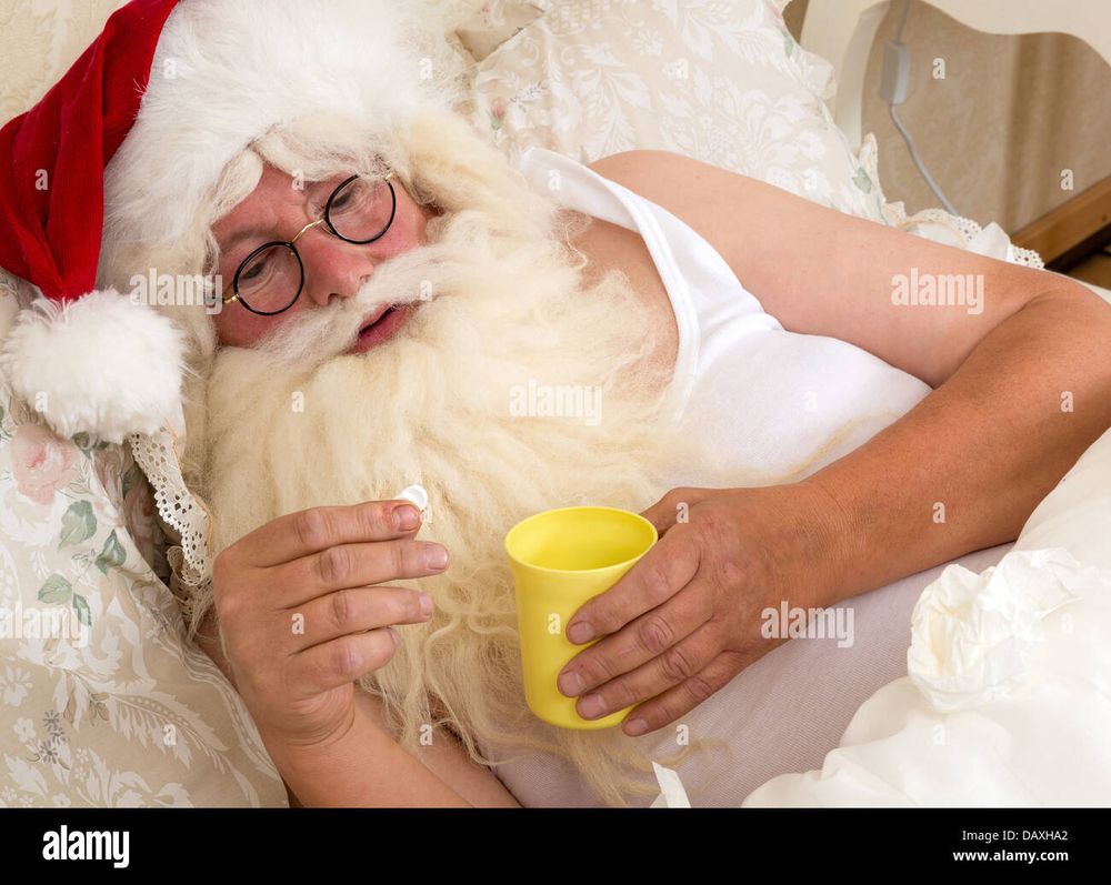 Santa Claus in a tank top BUT STILL the iconic hat BUT ALSO tucked into bed and about to pop a bean. Wait sorry I'm being told by Legal that this is an Alka-Seltzer. Of all the Santas this is the only one that looks legitimately under the weather......... but also.................. perchance a bit sensual??