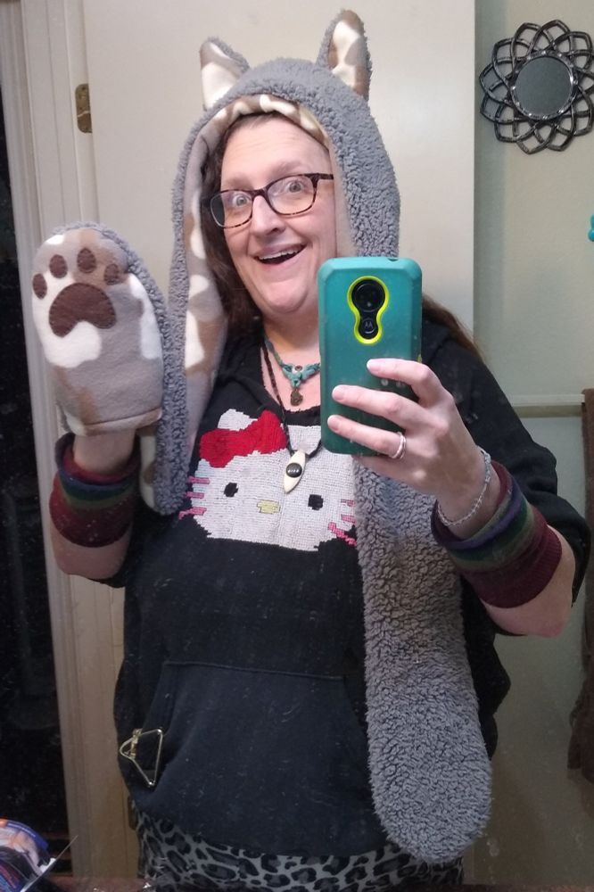 a gray fleece wolf hood with paw pockets, including hand stitched paw pads