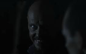 Final view of Ray from Mr. Inbetween. Ray is a mostly bald white man with a graying goatee. In the foreground, a younger man sits in the passenger seat of his taxi.
In the picture he is no longer looking at the passenger who intends to kill him, he looks into the camera and smiles.