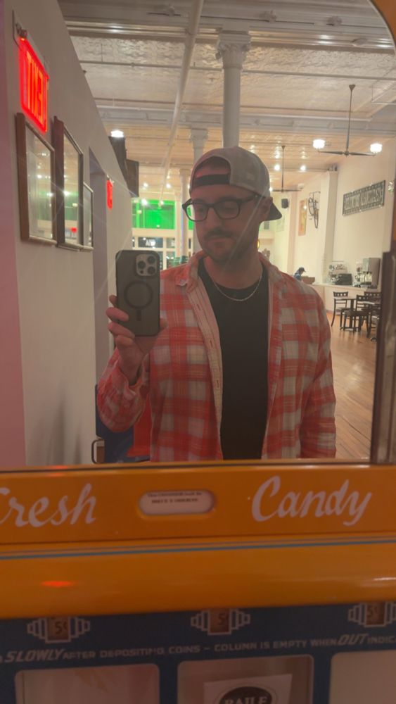 some lil goofball taking a mirror selfie