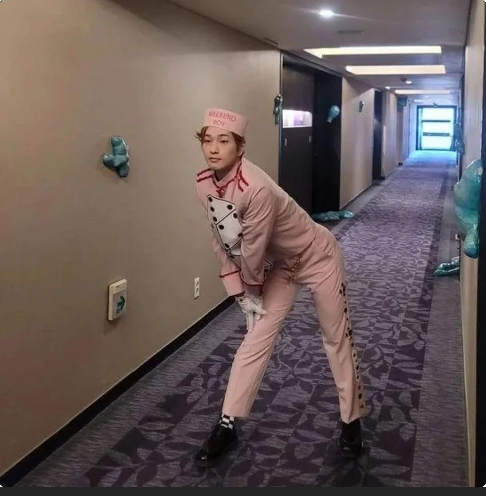 Random K-pop man dressed like a Bellboy
