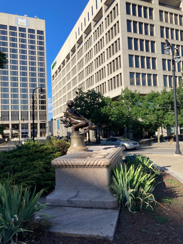 The Burnside Fountain- a fountain with a bronze statue of a boy riding a turtle