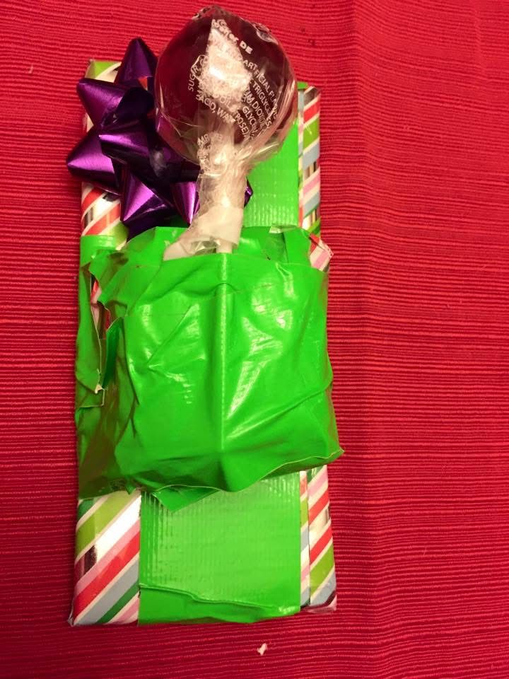 Christmas present wrapped with green duct tape. 