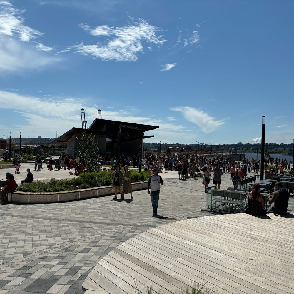 A public gathering area next to a port