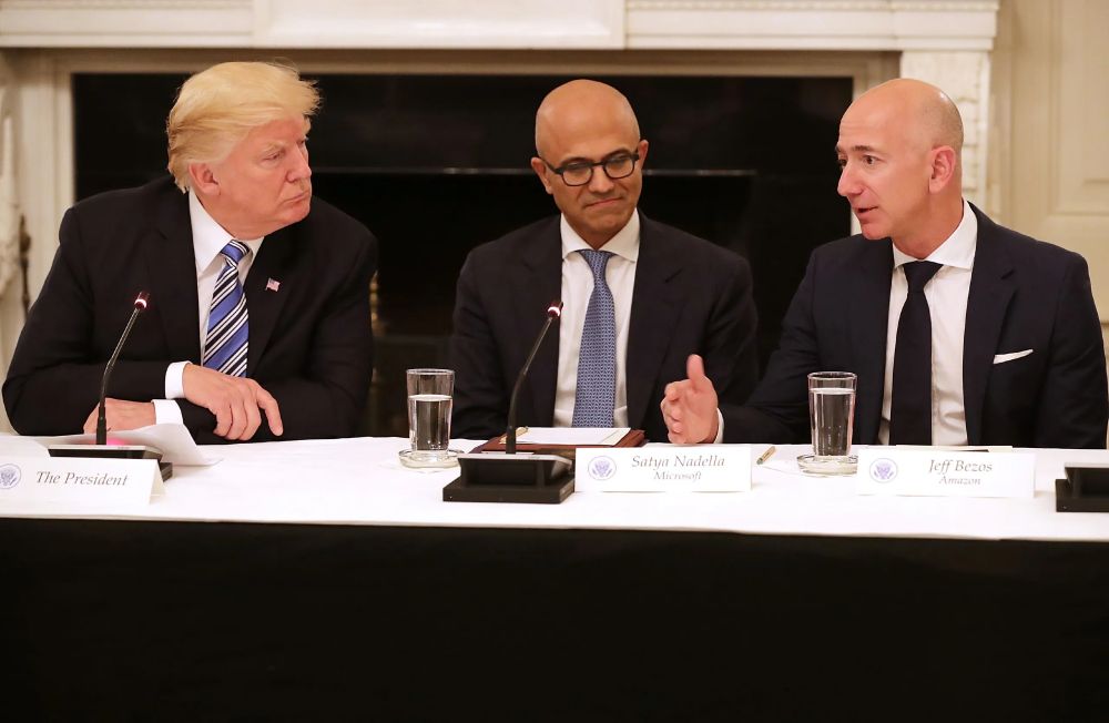 An image of Trump looking at Jeff Bezos, owner of the Washington Post