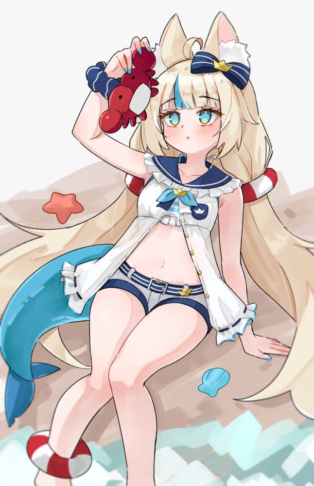 Sameko Saba laying on the shore holding up a crab and inspecting it