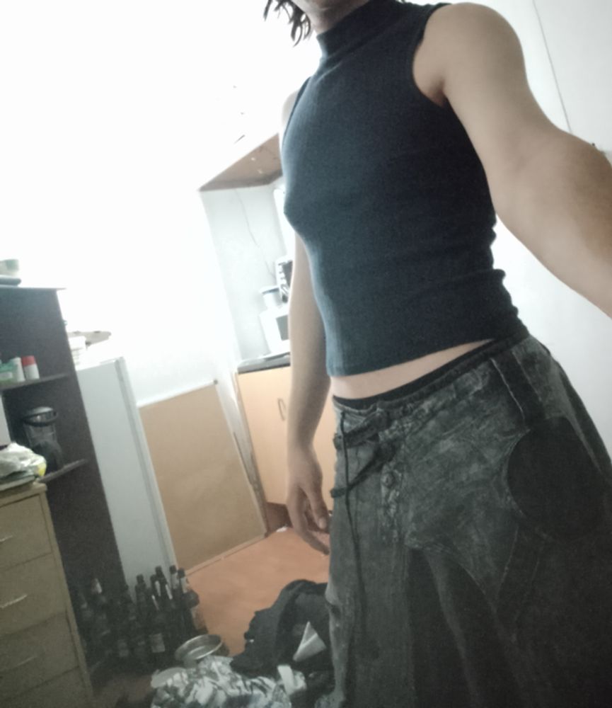 Me in a comfy outfit in a messy room