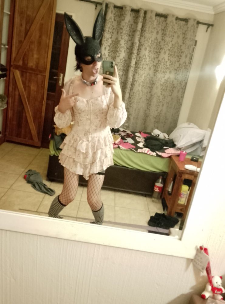 Me in a cute frilly skirt, fish nets and bunny mask