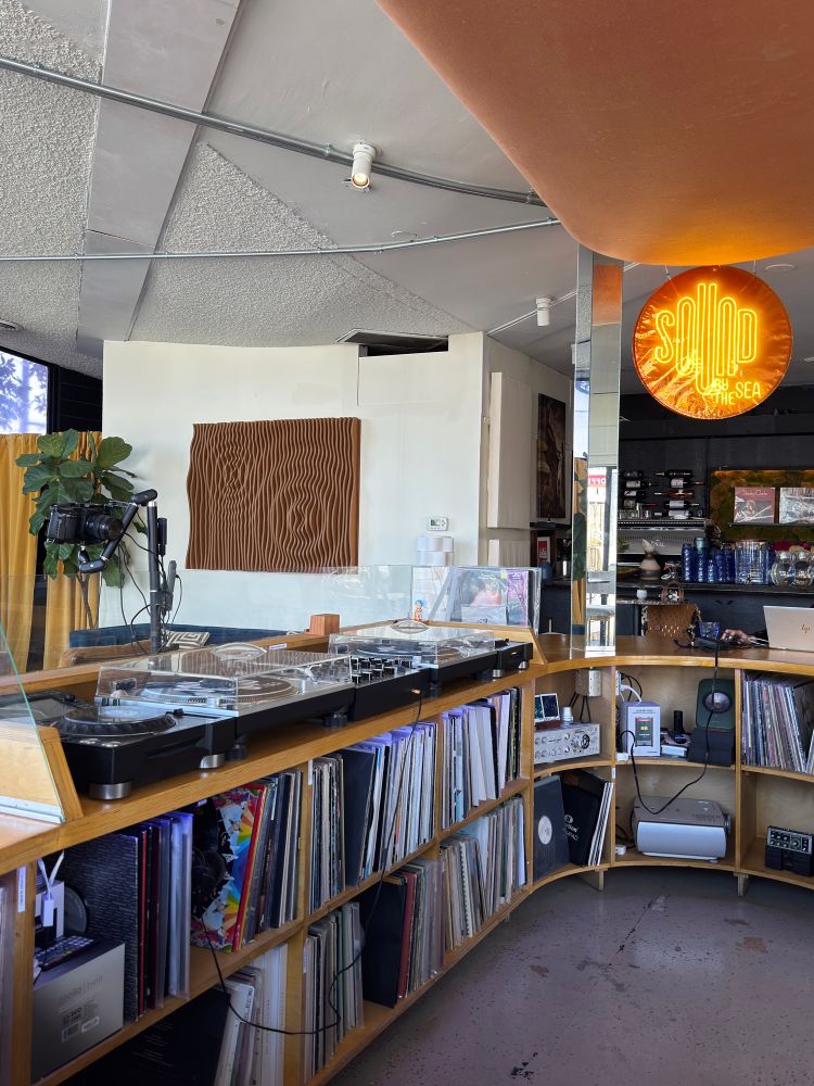 Turntables and mixer setup inside Sound by the Sea listening bar and restaurant 