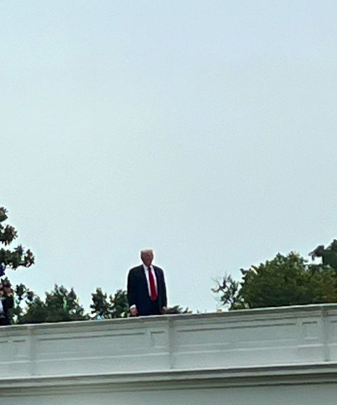 The president standing on the roof