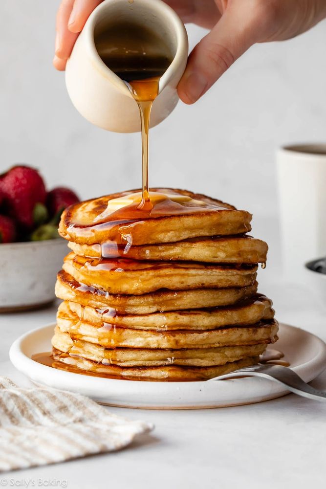 pancakes smothered in maple syrup