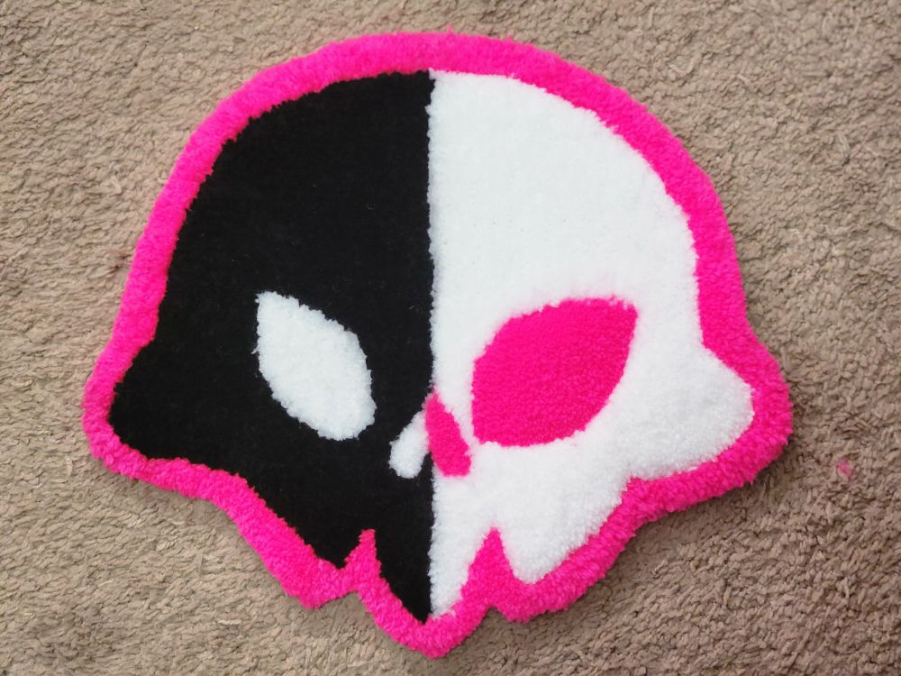 A rug shaped like a cartoon skull
