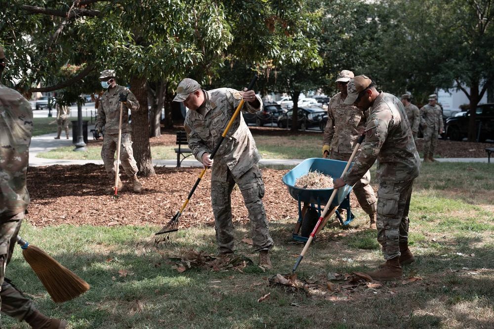 Air National Guard airmen work clearing leaves and debris in Washington, DC.