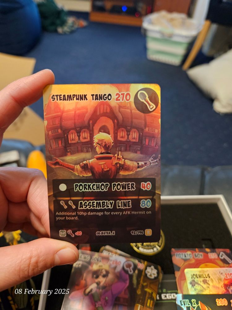 A holo full art card of Steampunk Tango from Hermitcraft TCG series 2