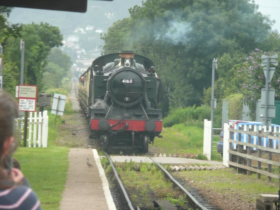 An eastbound-headed steam train coming into Williton on the West Somerset Railway.