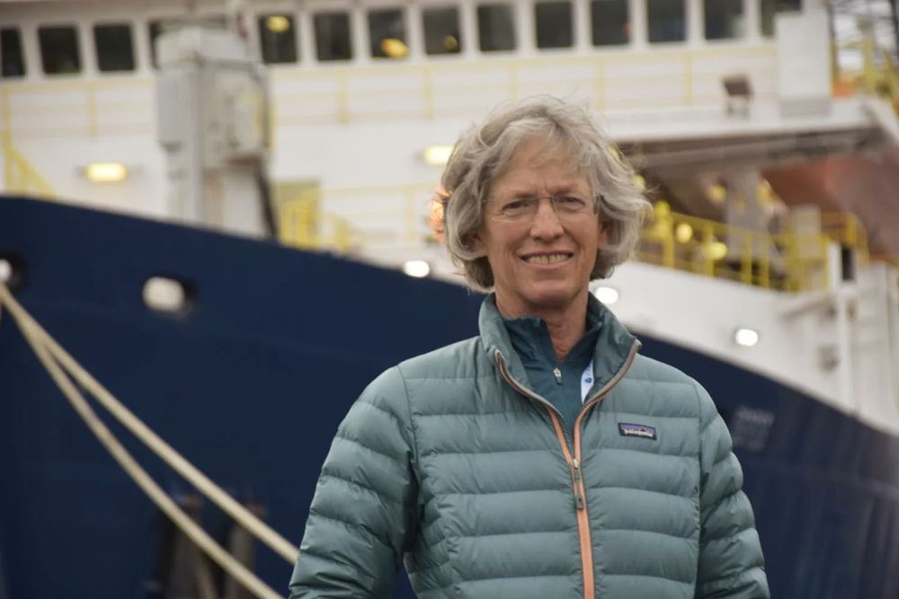 Anne Jennings in front of the JOIDES Resolution ship before they left for Greenland in August, 2023  (Credit: Philip Staudigel)
