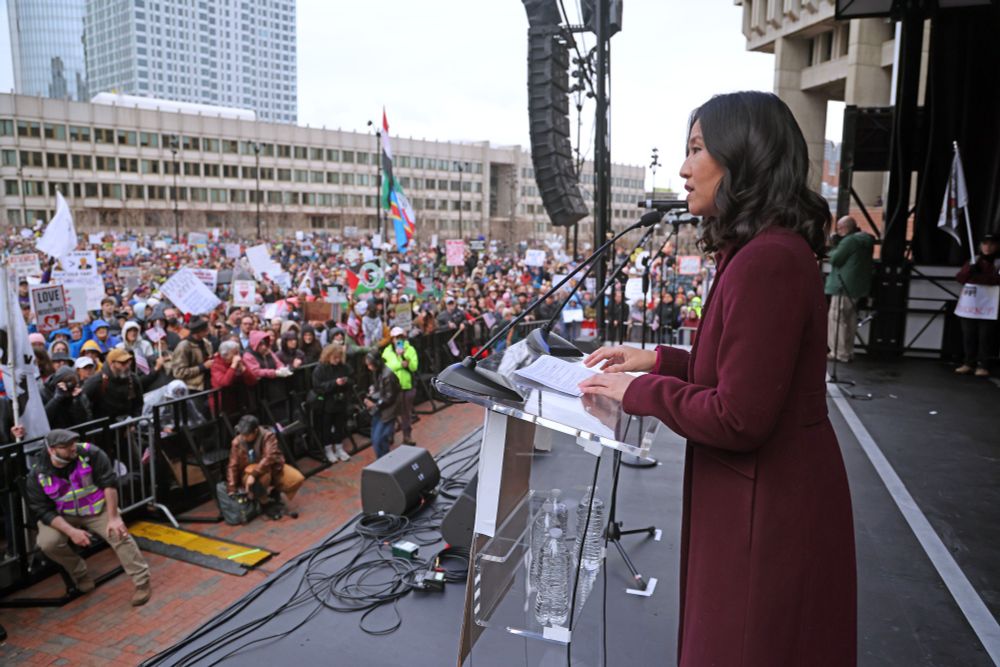 Mayor Wu speaks from the stage to a large crowd at City Hall Plaza.