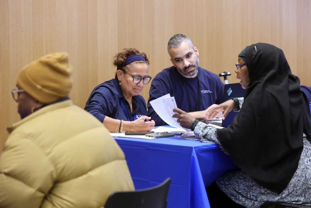 Residents and City staff meet and review tax information.