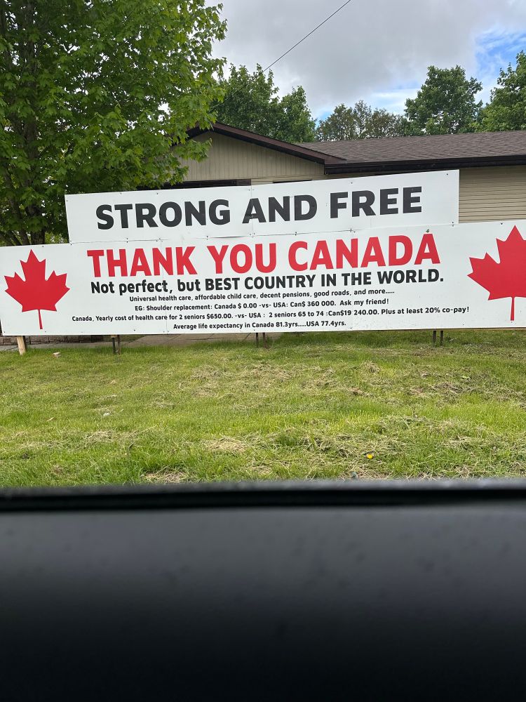 Huge lawn sign in Canada humbly and succinctly extolling its virtues 