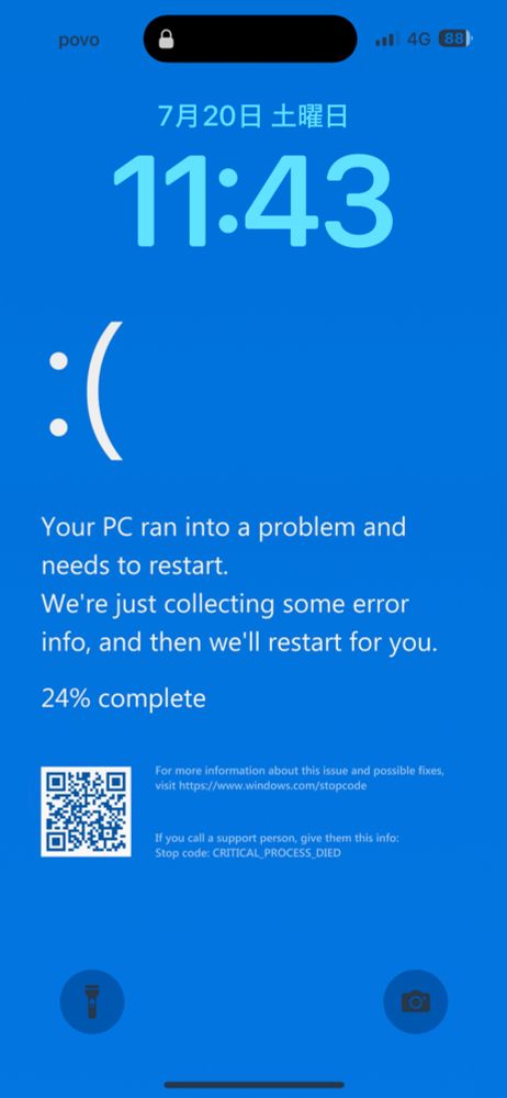 WindowsのBSOD画面をモチーフにした壁紙を iPhoneのロック画面に設定している様子
