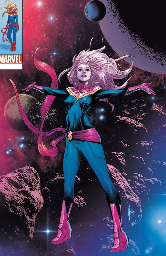 Captain Marvel is drifting through space with her arms outstretched.