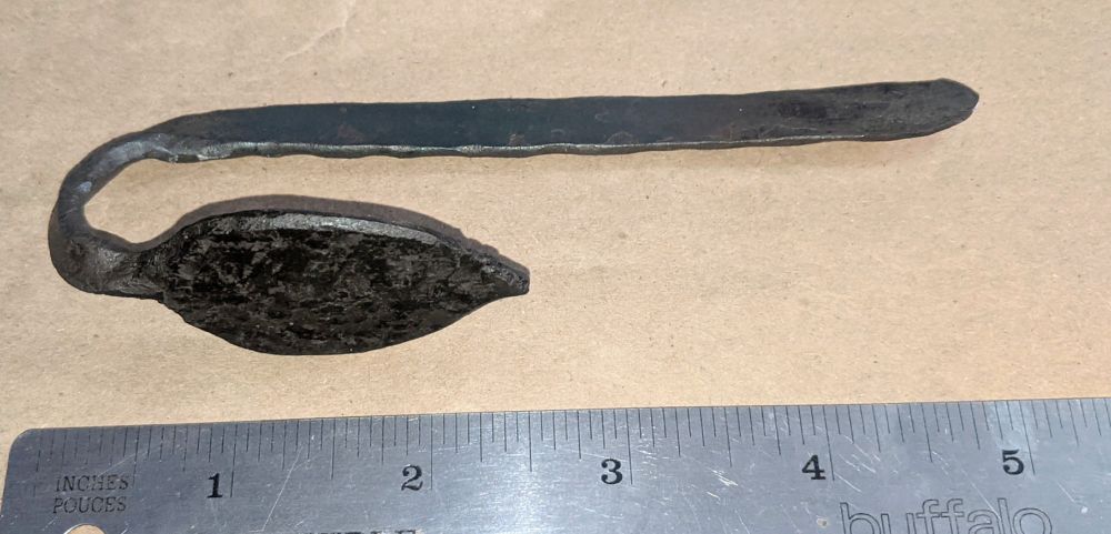 Hand forged bookmark with a leaf detail.