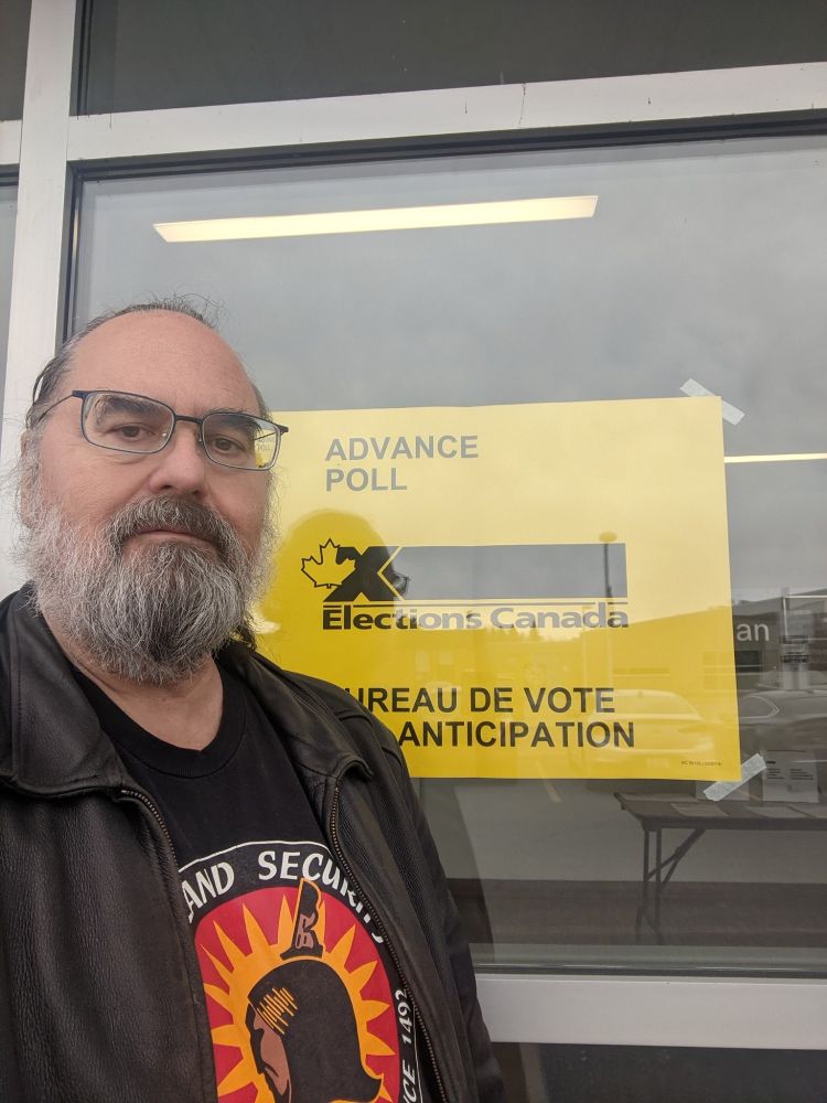 A photo of me in front of the Advance Poll Sign.