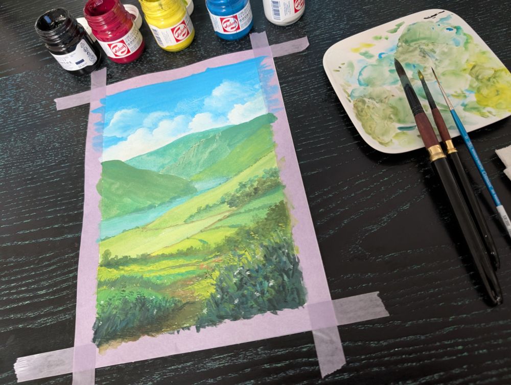 Picture of the painting above on my desk surrounded by painting supply.