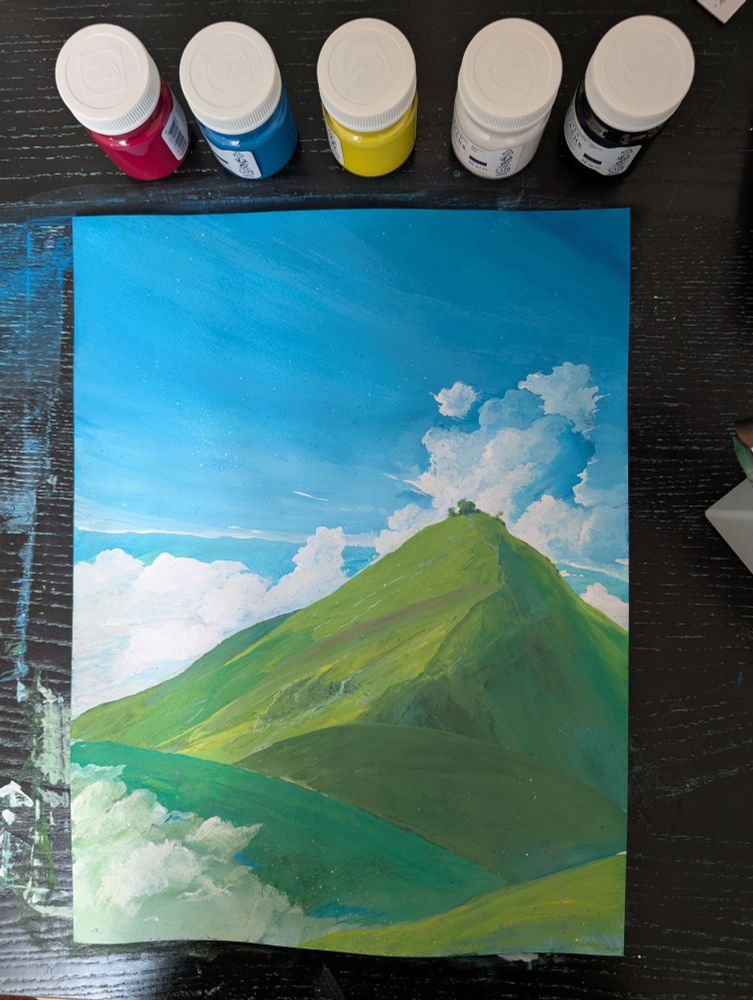Painting above on a desk.