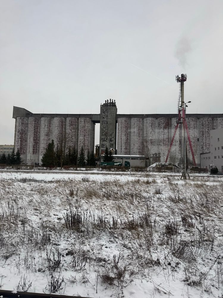 an industrial building in snow in Poland. It almost looks monochrome 