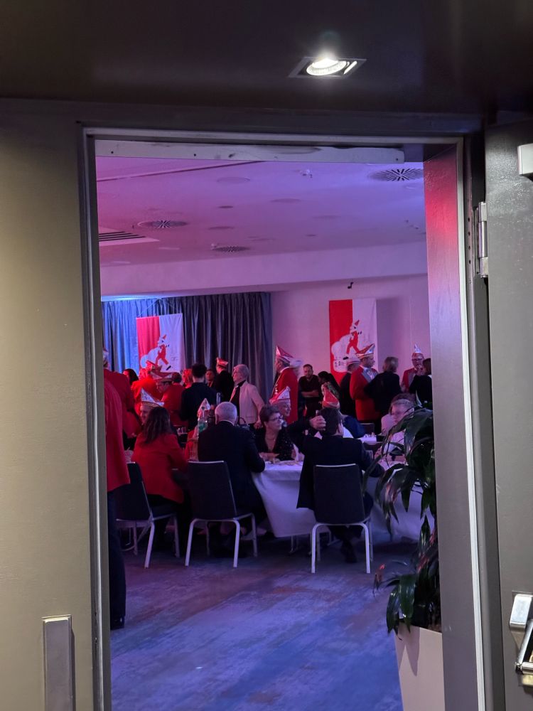 Lots of men dressed up in red outfits and red hats in Cologne 