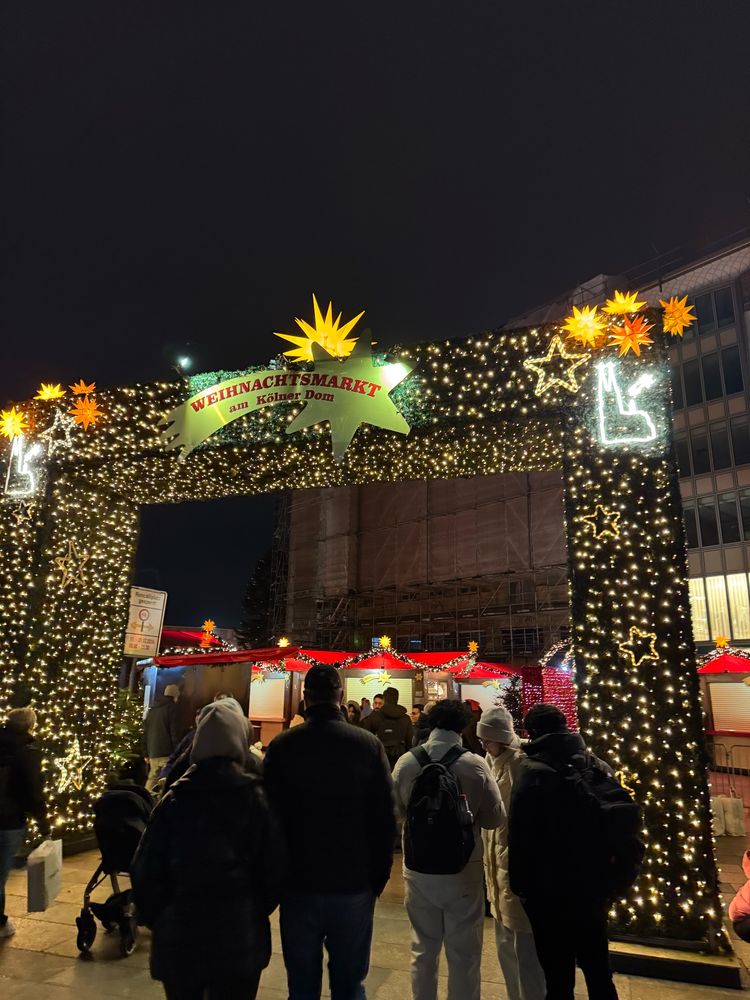 The festive lights at the entrance to the Christmas market in Cologne. Sadly it is not open yet 