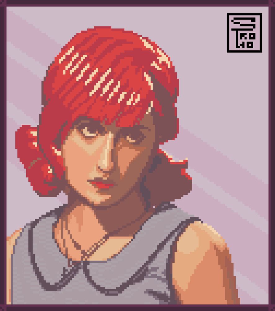 Portrait of a woman named Haley Williams. She has a stern look and a serious but neutral expression on her face, while staring at what seems to be a mirror or a frame of herself.