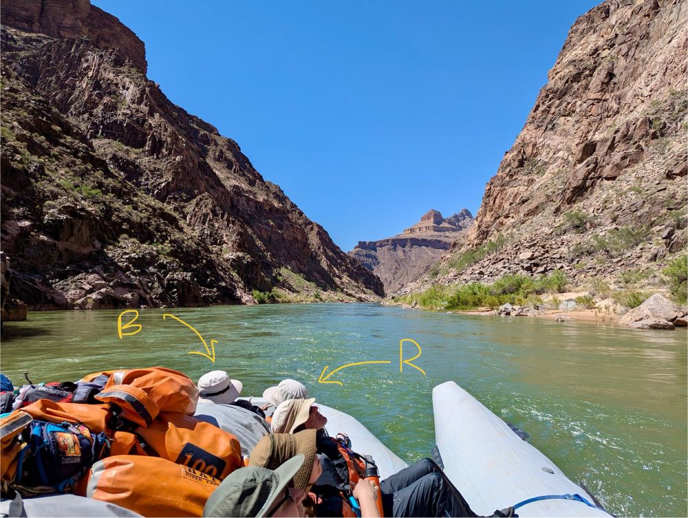 B&R at the front of a river raft traveling down the Colorado River through the Grand Canyon