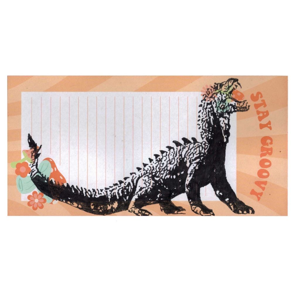 Pen drawing of a reptile monster with sharp teeth drawn on a piece of hippie-themed stationery.