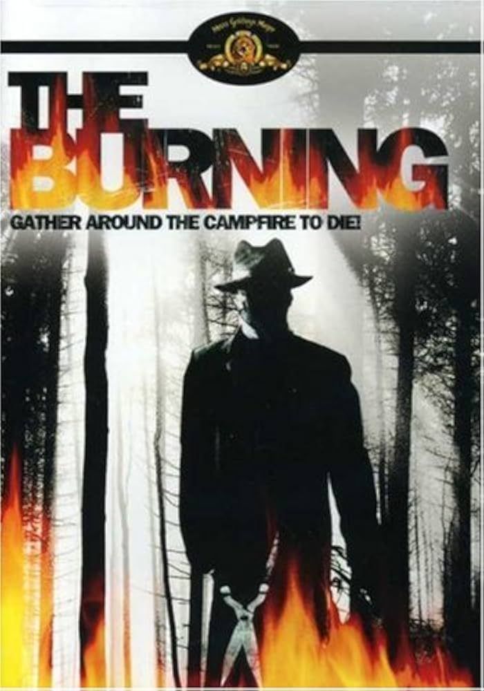 Image of the DVD cover for The Burning featuring a shadown figure holding gardening sheers walking throug ha forest with flames around the border beneath the title.