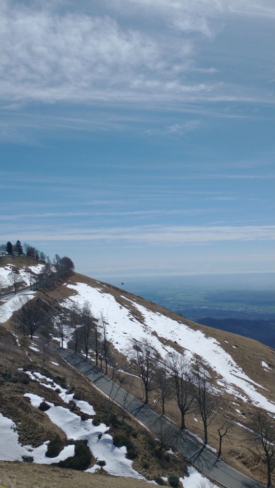The view (from the same location of the previous picture) facing Southeast. Most of the distant landscape is occupied by the Po Valley, an area where the human impact has been tremendously high for millennia. On the horizon, some mountains can be seen: those on the left are the Northern Apennines (around 140 km away), part of the long mountain chain that could be referred to as the "backbone" of peninsular Italy. Along the coast of the Ligurian Sea it joins the Southwestern most part of the Alps (the Maritime Alps, that can be barely seen here on the right part of the horizon).
