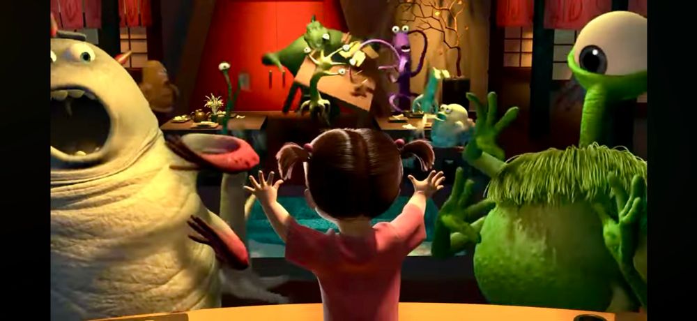 Monster’s Inc screenshot when Boo yells ‘Boo!’ in the restaurant scaring all the patrons.