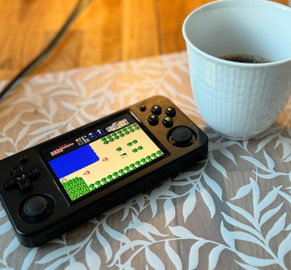 Anbernic 35xx H handheld console with the game The Legend of Zelda showing on screen
