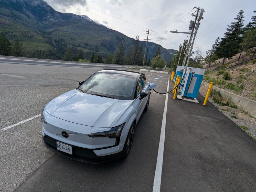 Charging an electric Volvo EX30 at a rest area near Lytton, BC.