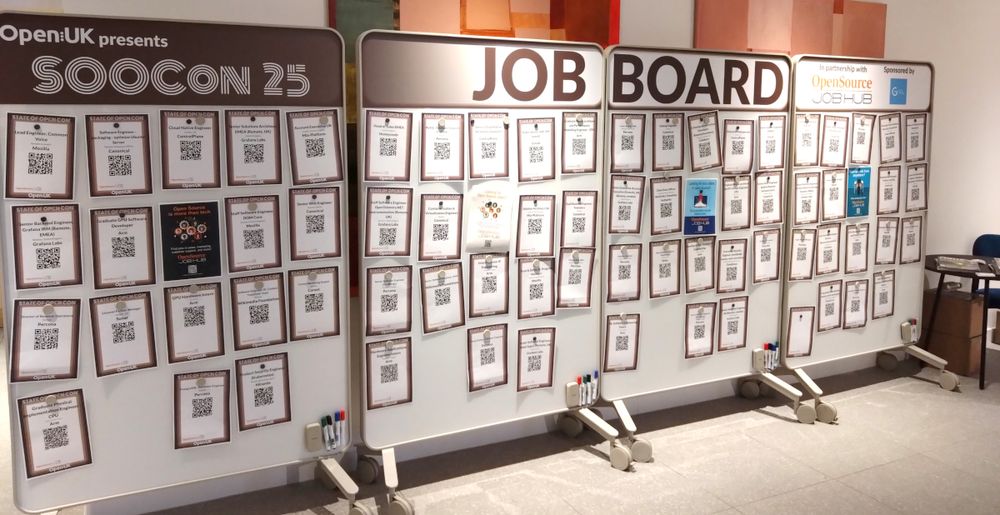 (picture of three rolling white boards covered in job postings) OpenUK Presents SOOCon 25 JOB BOARD in partnership with Open Source JobHub sponsored by G-Research