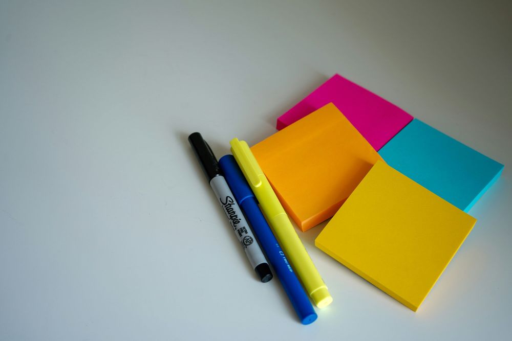 Photo by Ravi Palwe on Unsplash:

https://unsplash.com/photos/blue-and-black-pen-beside-orange-sticky-notes-I3urDa6z2_4
