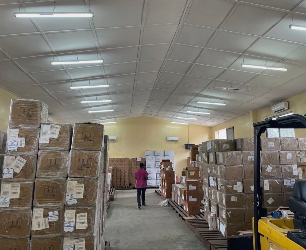Photograph of a warehouse in Kinshasa where unboxed tuberculosis medications are going undistributed due to the stop work order by the Trump Administration.