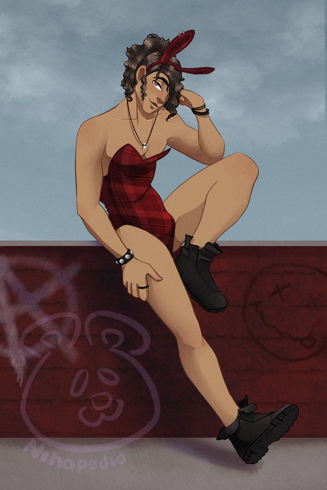 Man leaning against a gratified wall wearing a red play bunny suit.