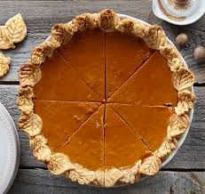 Photo of a sliced pumpkin pie