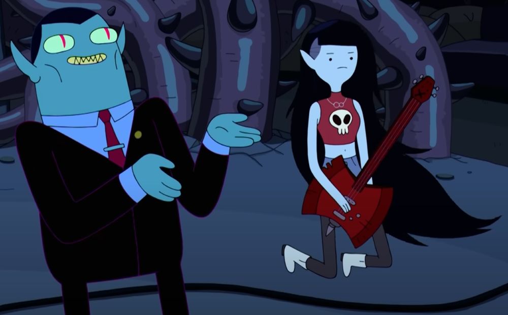 Adventure Time's Hunsen Abadeer and his daughter Marceline, the vampire queen. Hunsen wears a dark suit, periwinkle dress shirt and burgundy tie with clip. Marceline floats beside him with her long black hair wearing a burgundy coloured crop top with a skull logo, and grey cigarette jeans. She holds her red Ax Bass.
