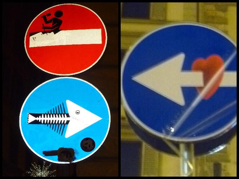 Drei Verkehrsschilder, die durch Bemalen verändert worden sind.