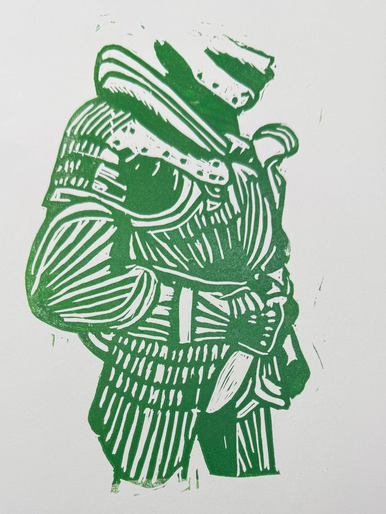 the body of a figure in armor in a green linocut 