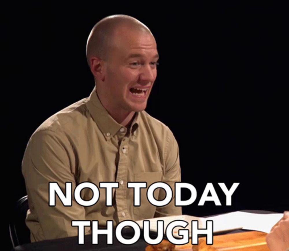 a man sitting at a table with the words not today though written on the screen