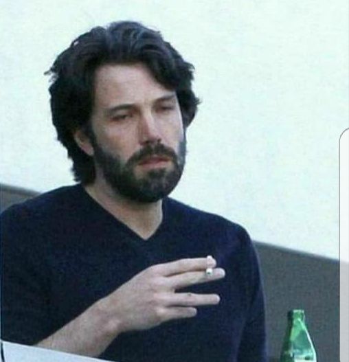 image of ben affleck looking dead inside with a cigarette